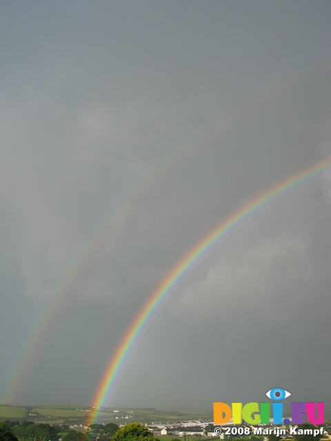 27066 Double raindbow over industrial estate in fields